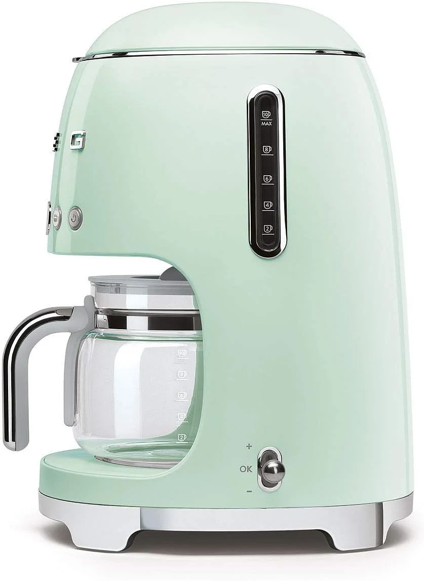 دستگاه قهوه ساز قطره ای Smeg Dcf02PgUK، ظرفیت 10 فنجان، حالت شروع خودکار، فیلتر قابل استفاده مجدد، صفحه نمایش دیجیتال، سیستم ضد چکه، گزینه شدت عطر، مخزن 1.4 لیتری، سبز پاستیلی، 1 سال گارانتی دستگاه قهوه ساز قطره ای Smeg Dcf02PgUK، ظرفیت 10 فنجان، حالت شروع خودکار، فیلتر قابل استفاده مجدد، صفحه نمایش دیجیتال، سیستم ضد چکه، گزینه شدت عطر، مخزن 1.4 لیتری، سبز پاستیلی، 1 سال گارانتی