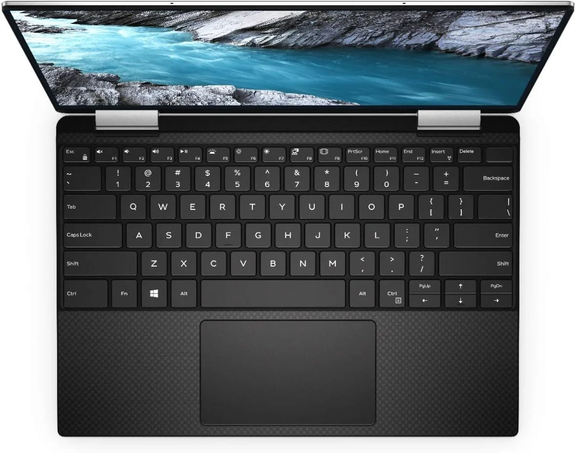 لپ تاپ فوق سبک تبدیل شونده Dell XPS 13 9310، پردازنده نسل 11 اینتل Core i7-1165G7، صفحه نمایش 13.4 اینچی FHD، حافظه SSD 512 گیگابایتی، رم 16 گیگابایتی، گرافیک Intel® Iris® Xe، ویندوز 10 هوم، کیبورد انگلیسی-عربی، نقره ای لپ تاپ فوق سبک تبدیل شونده Dell XPS 13 9310، پردازنده نسل 11 اینتل Core i7-1165G7، صفحه نمایش 13.4 اینچی FHD، حافظه SSD 512 گیگابایتی، رم 16 گیگابایتی، گرافیک Intel® Iris® Xe، ویندوز 10 هوم، کیبورد انگلیسی-عربی، نقره ای