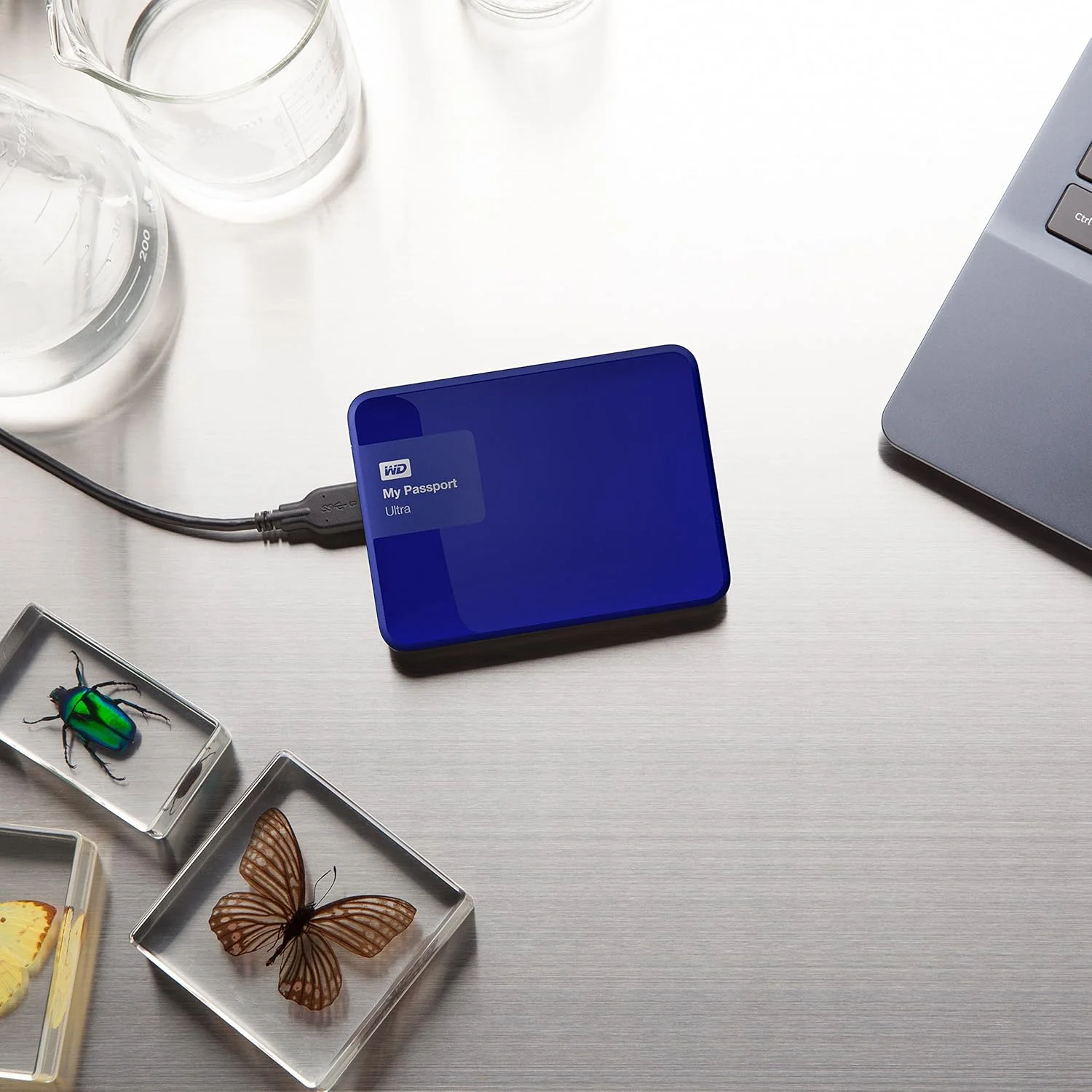 هارد اکسترنال قابل حمل و امن WD My Passport Ultra با ظرفیت 1 ترابایت و USB 3.0، آبی (مدل قدیمی) (WDBGPU0010BBL-NESN)