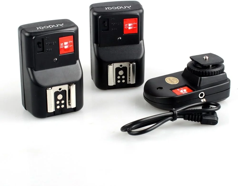 ست فلاش تریگر بیسیم 4 کاناله Andoer PT-04GY یونیورسال شامل 1 فرستنده و 2 گیرنده برای Canon Nikon Pentax Olympus ست فلاش تریگر بیسیم 4 کاناله Andoer PT-04GY یونیورسال شامل 1 فرستنده و 2 گیرنده برای Canon Nikon Pentax Olympus