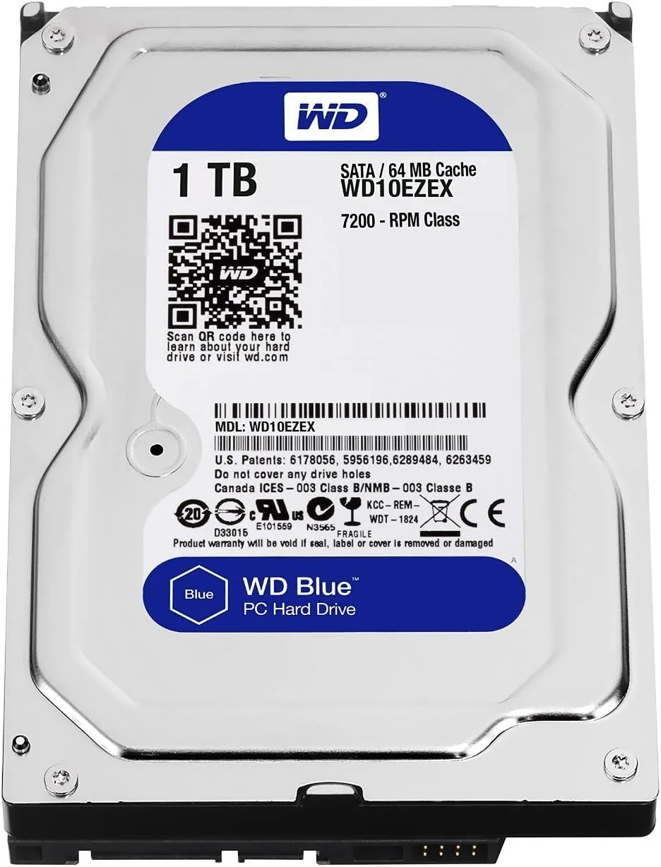 هارد دیسک وسترن دیجیتال (WD) آبی 1 ترابایت، 3.5 اینچ، 5400 تا 7200 دور در دقیقه، SATA3 (6.0 گیگابایت بر ثانیه)، 64 مگابایت حافظه کش، ایده آل برای PC/Mac/CCTV/NAS/DVR/Raid و برنامه های SATA، 1 سال گارانتی (آبی)