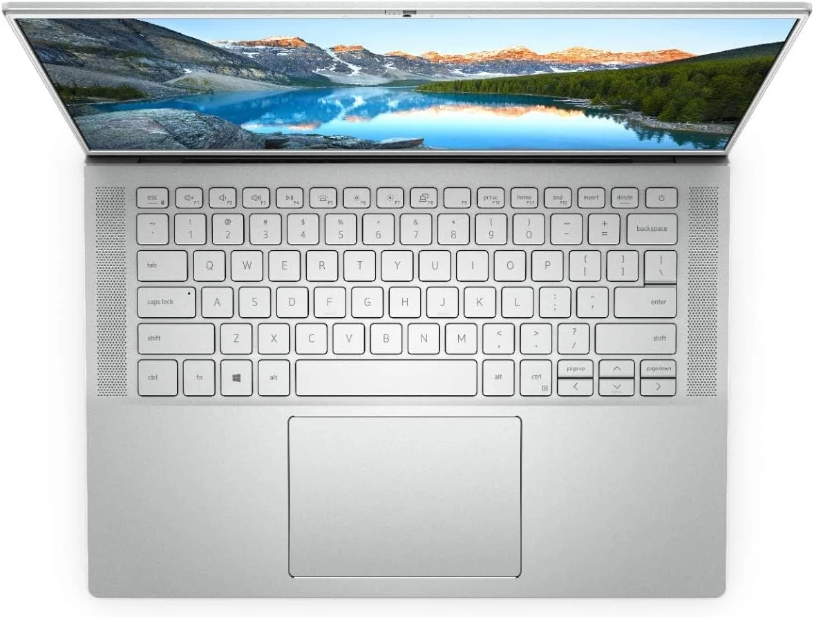 لپ تاپ فوق باریک Dell Inspiron 14 7400، پردازنده نسل 11 اینتل Core i5-1135G7، صفحه نمایش 14.5 اینچی QHD+، حافظه SSD 256 گیگابایتی، رم 8 گیگابایتی، گرافیک Intel® Iris® Xe، ویندوز 10 هوم، صفحه کلید انگلیسی عربی، نقره ای