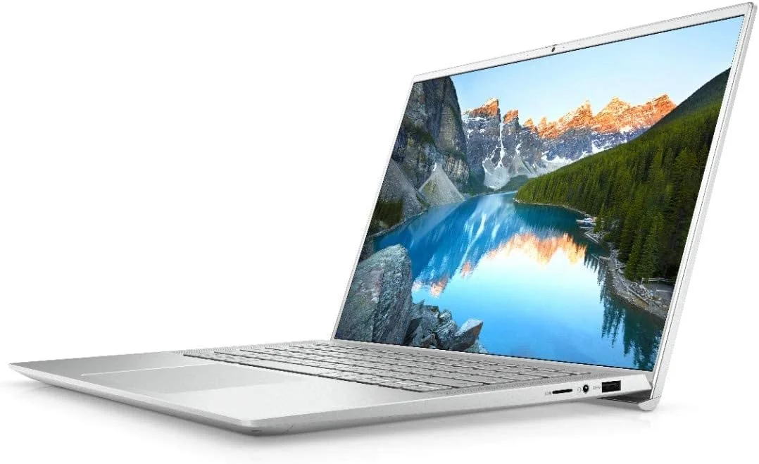 لپ تاپ فوق باریک Dell Inspiron 14 7400، پردازنده نسل 11 اینتل Core i5-1135G7، صفحه نمایش 14.5 اینچی QHD+، حافظه SSD 256 گیگابایتی، رم 8 گیگابایتی، گرافیک Intel® Iris® Xe، ویندوز 10 هوم، صفحه کلید انگلیسی عربی، نقره ای