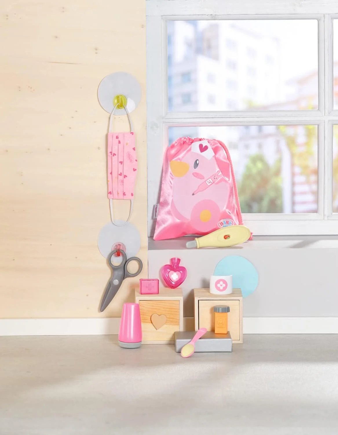 ست کمک های اولیه عروسک بیبی بورن مدل 834091 - لوازم جانبی عروسک های بیبی بورن - شامل 9 لوازم جانبی پزشکی عروسک و کیف بند دار - مناسب برای کودکان 3 سال به بالا، صورتی