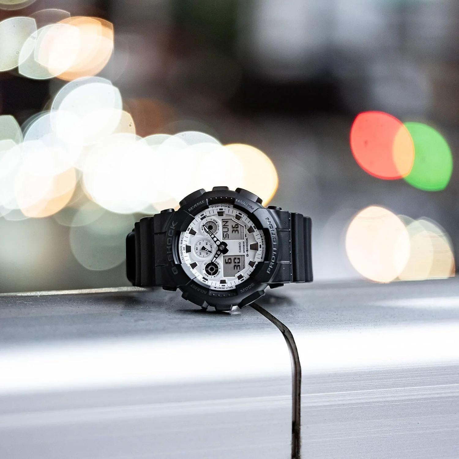 ساعت مچی عقربه ای کوارتز کاسیو مدل GA-100WD-1AER، بند دار، مناسب برای آقایان و بانوان