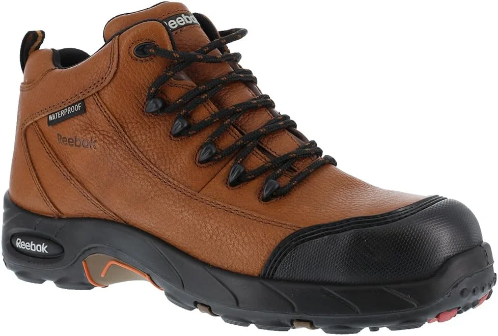 کفش کار ریباک مدل Tiahawk RB4444 - کفش پیاده روی ورزشی ضد آب مردانه با پنجه کامپوزیت، محافظت در برابر خطرات الکتریکی، پهنای بسیار زیاد و کیسه هوای Aircom™ در پاشنه که مطابق با استانداردهای ایمنی ASTM F2413 است.