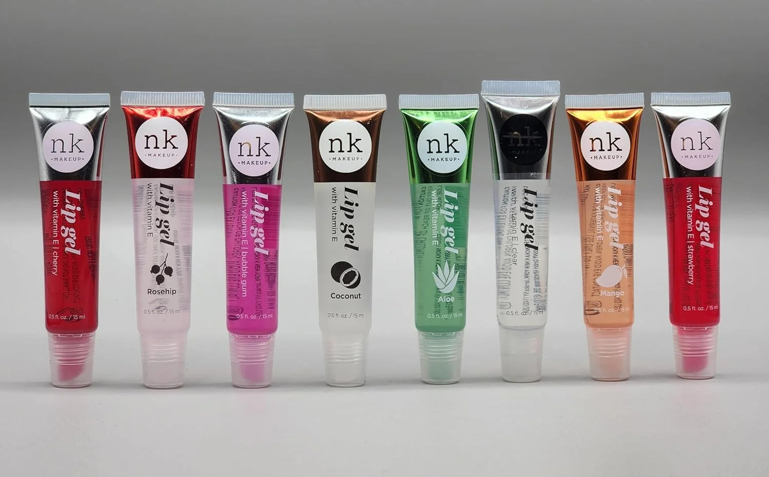 nicka k new york Assorted Set of 8 Lip Glosses with Vitamin E by Nicka-K (Clear, Rosehip, Coconut, Aloe Vera, Mango, Strawberry, Gum, Cherry)