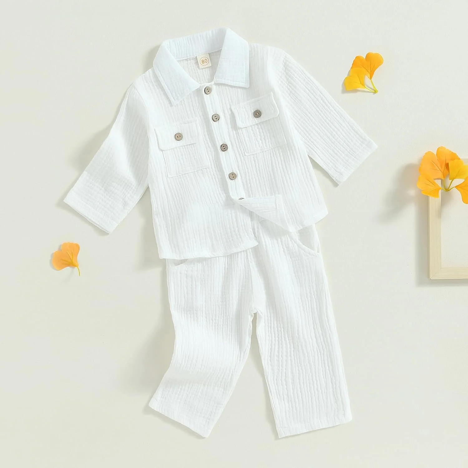 ست لباس پسرانه تابستانی شامل پیراهن آستین کوتاه دکمه دار و شلوار بلند با طرح رنگی، مناسب کودکان