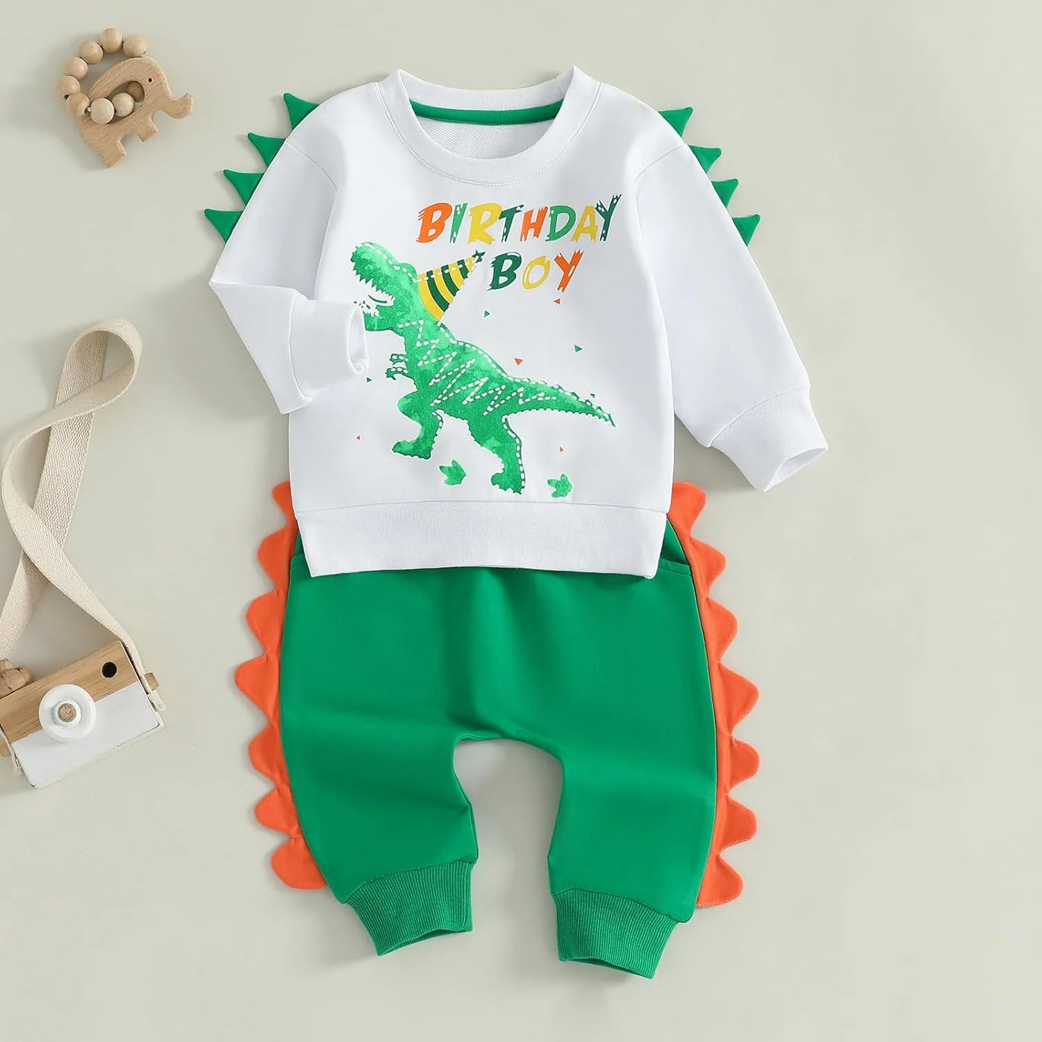 لباس تولد پسرانه Carolilly، ست بلوز آستین بلند و شلوار کمر کشی با طرح دایناسور، مناسب هدیه تولد