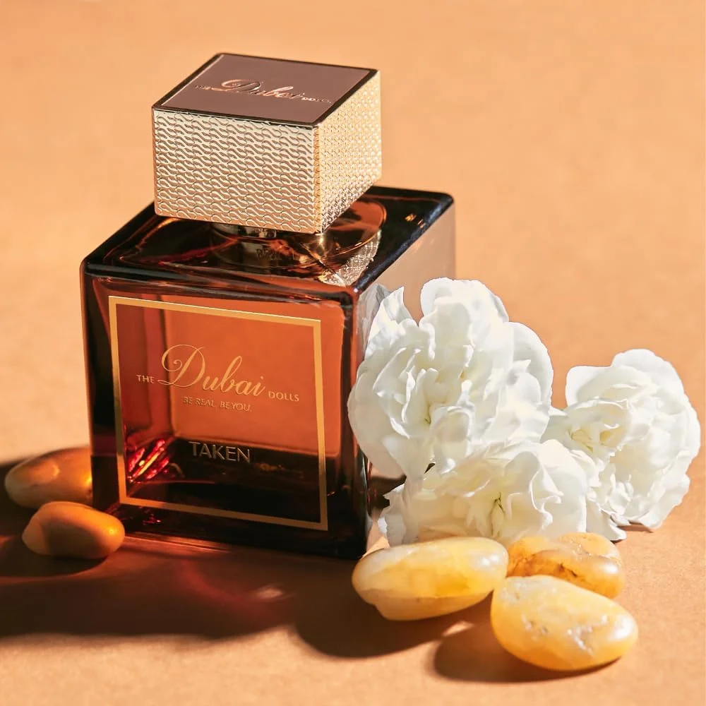 ادکلن زنانه لوکس دبی دالز مدل TAKEN | عطر عود با رایحه چوبی و پایانی جذاب | مناسب برای روز و شب | یاس، زعفران و عنبر (100 میلی لیتر)