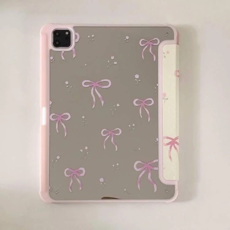 کیف چرمی سخت تاشو با آینه و پایه قابل تنظیم برای آیپد 10 (نسل دهم 10.9 اینچی 2022) - رنگ سفید کرمی، پاپیون صورتی، طرح گلدار زیبا، شیک، جذاب و دوست داشتنی مناسب دختران و کودکان