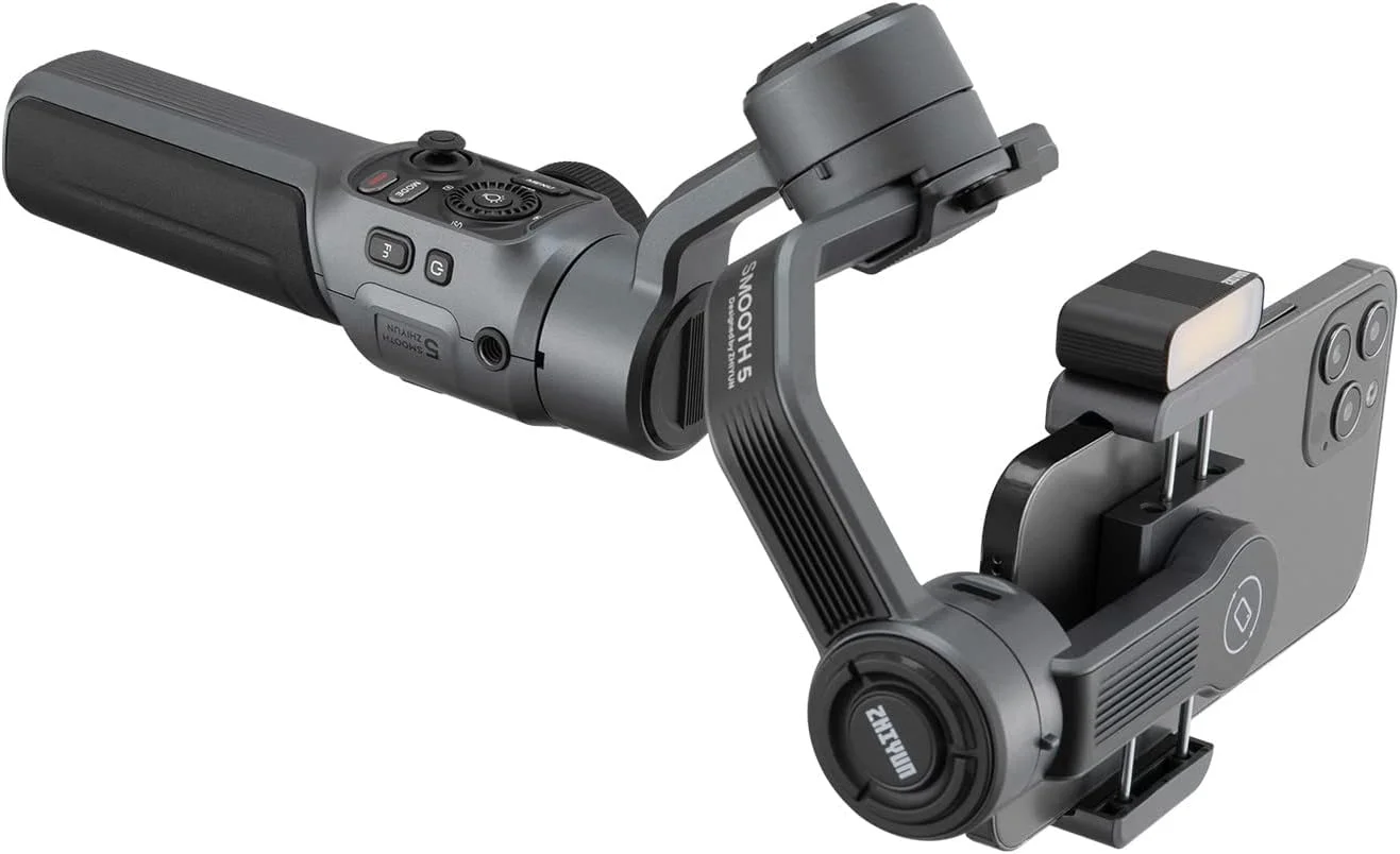 لرزشگیر موبایل ژیون اسموث 5 کمبو به همراه نور مغناطیسی، کیف حمل و سه پایه، گیمبال تثبیت کننده 3 محوره حرفه ای برای گوشی های هوشمند آیفون 14 پرو مکس پلاس 13 12 11 X XS XR Mini SE 8 7 و تلفن های همراه اندروید لرزشگیر موبایل ژیون اسموث 5 کمبو به همراه نور مغناطیسی، کیف حمل و سه پایه، گیمبال تثبیت کننده 3 محوره حرفه ای برای گوشی های هوشمند آیفون 14 پرو مکس پلاس 13 12 11 X XS XR Mini SE 8 7 و تلفن های همراه اندروید