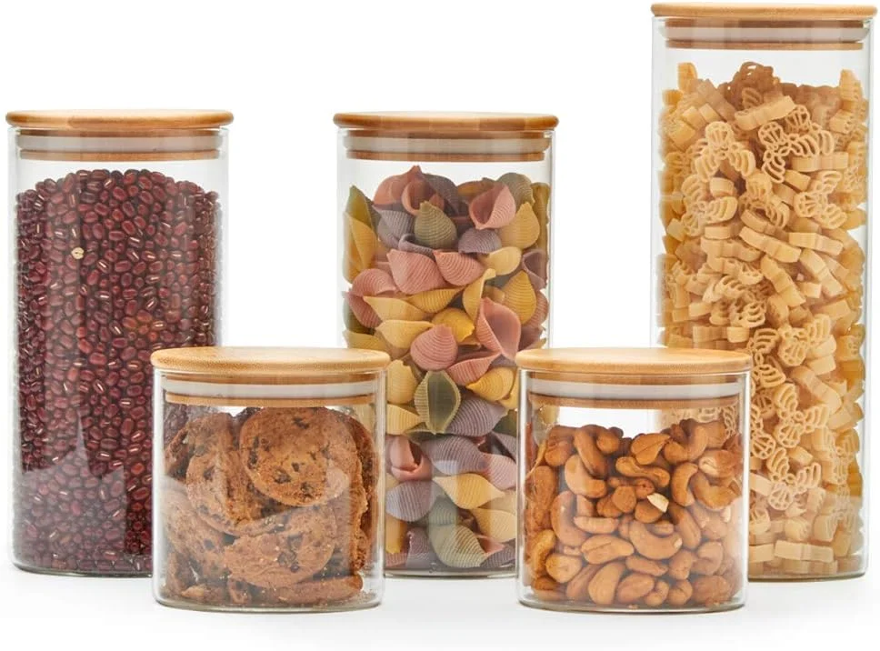 ست 5 تکه ظروف شیشه ای شفاف EZOWare با درب بامبو طبیعی، ظروف نگهداری مواد غذایی آشپزخانه برای آبنبات، کلوچه، برنج، شکر، آرد، پاستا - 600 میلی لیتر / 1400 میلی لیتر / 2100 میلی لیتر ست 5 تکه ظروف شیشه ای شفاف EZOWare با درب بامبو طبیعی، ظروف نگهداری مواد غذایی آشپزخانه برای آبنبات، کلوچه، برنج، شکر، آرد، پاستا - 600 میلی لیتر / 1400 میلی لیتر / 2100 میلی لیتر