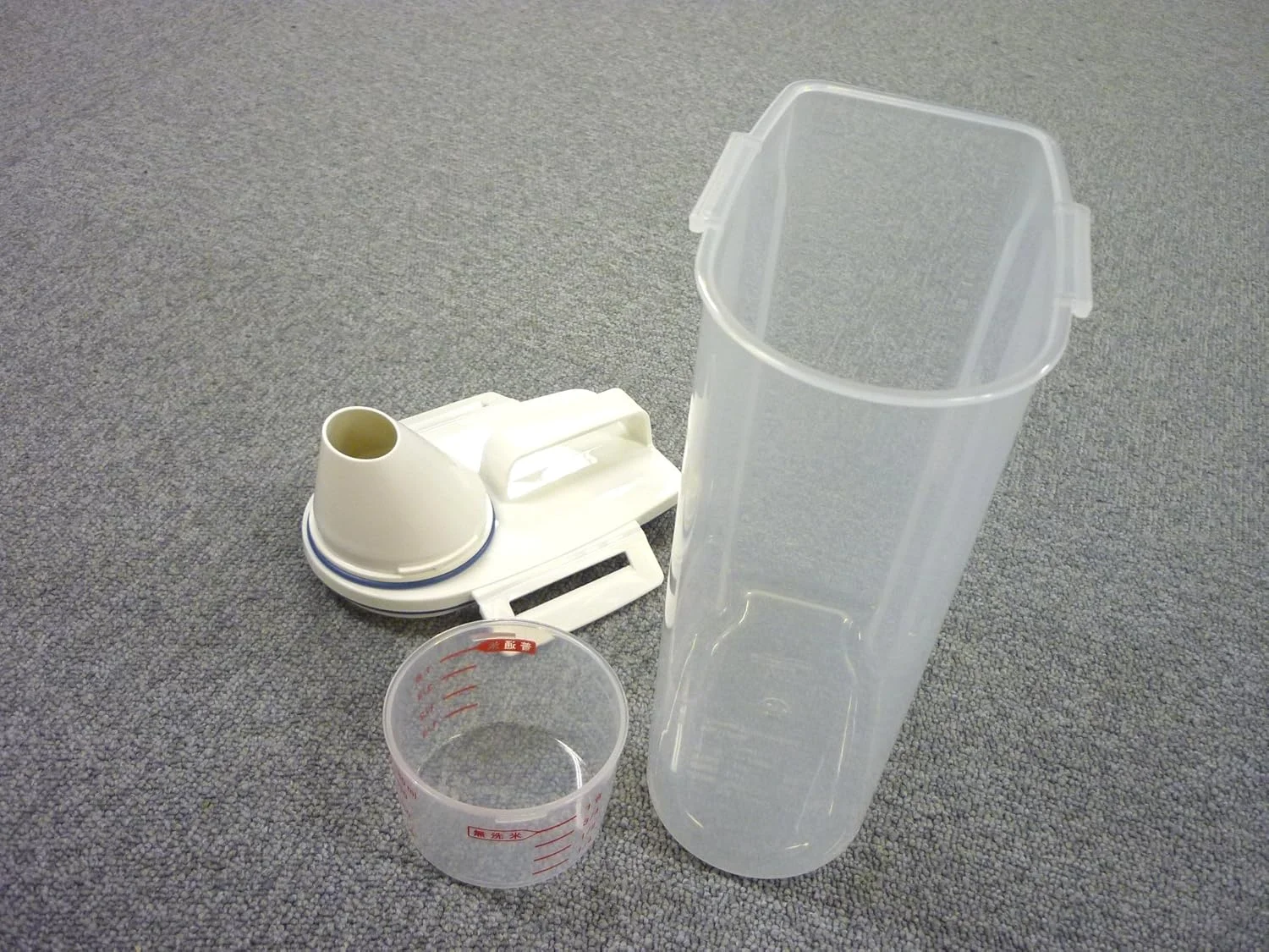 ظرف برنج Asvel 7509 با خروجی پلاستیکی شفاف 2 کیلوگرمی ظرف برنج Asvel 7509 با خروجی پلاستیکی شفاف 2 کیلوگرمی