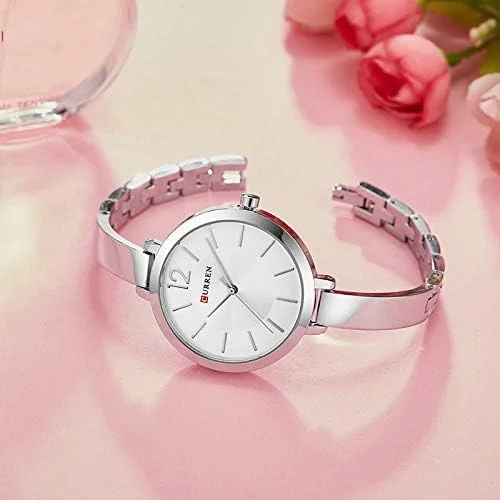 ساعت مچی زنانه کورن مدل 9012 با صفحه گرد و بند استیل ضد آب - نقره ای ساعت مچی زنانه کورن مدل 9012 با صفحه گرد و بند استیل ضد آب - نقره ای