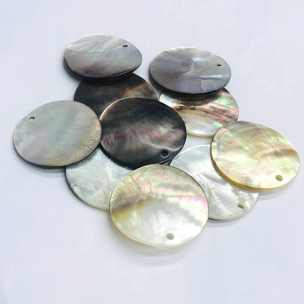 ۱۲ عدد دکمه صدفی مرواریدی طرح مادر، گرد ۴۲ میلی متر، رنگ قهوه ای روشن ۱۲ عدد دکمه صدفی مرواریدی طرح مادر، گرد ۴۲ میلی متر، رنگ قهوه ای روشن