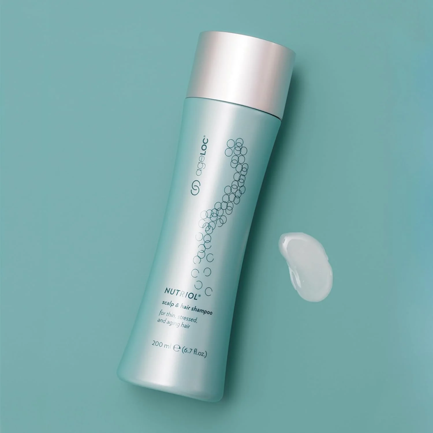 شامپو مو و پوست سر نوتریول ایج لاک Nu Skin | 200 میلی لیتر | فرمول موهای پرپشت تر با ویتامین E و آنتی اکسیدان ها | تغذیه کننده موهای خشک و آسیب دیده | مناسب برای موهای رنگ شده | استفاده روزانه برای انواع مو