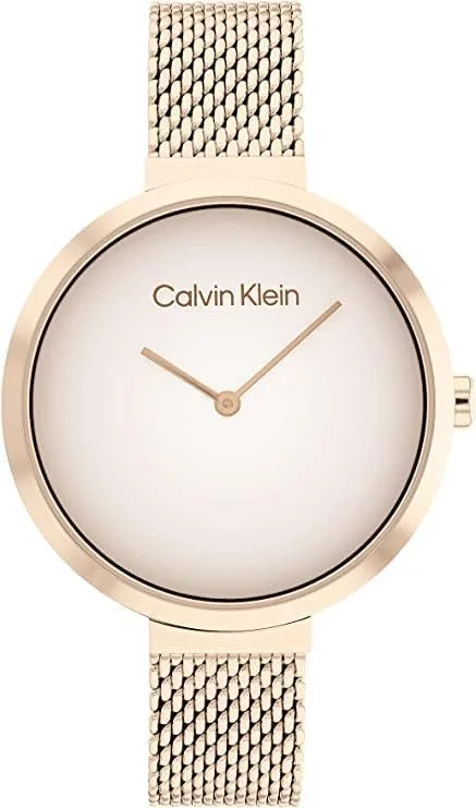 ساعت مچی زنانه کلوین کلاین با صفحه سفید و قاب پیچ خورده، بند استیل + گوشواره میخی زنانه کلوین کلاین مدل Molten Pebble