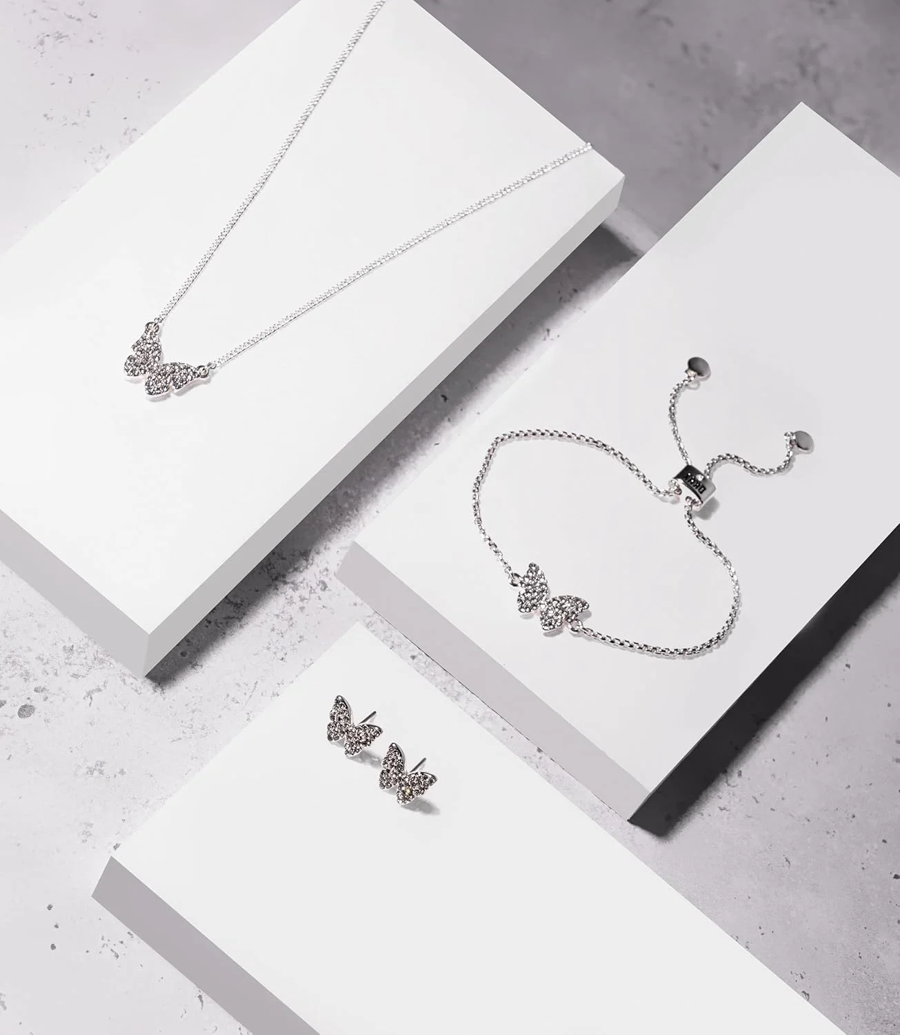 گوشواره های میخی پروانه ای زنانه DKNY طلایی با سنگ های کریستالی، 60538642، تیتانیوم روی