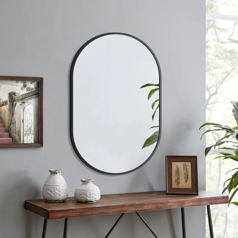 آینه دیواری بیضی شکل مشکی WOWINNE، ابعاد 80 × 50 سانتی متر، با قاب فلزی، آینه تزئینی برای حمام، اتاق نشیمن، اتاق خواب، سرویس بهداشتی مهمان، قابل نصب به صورت عمودی و افقی