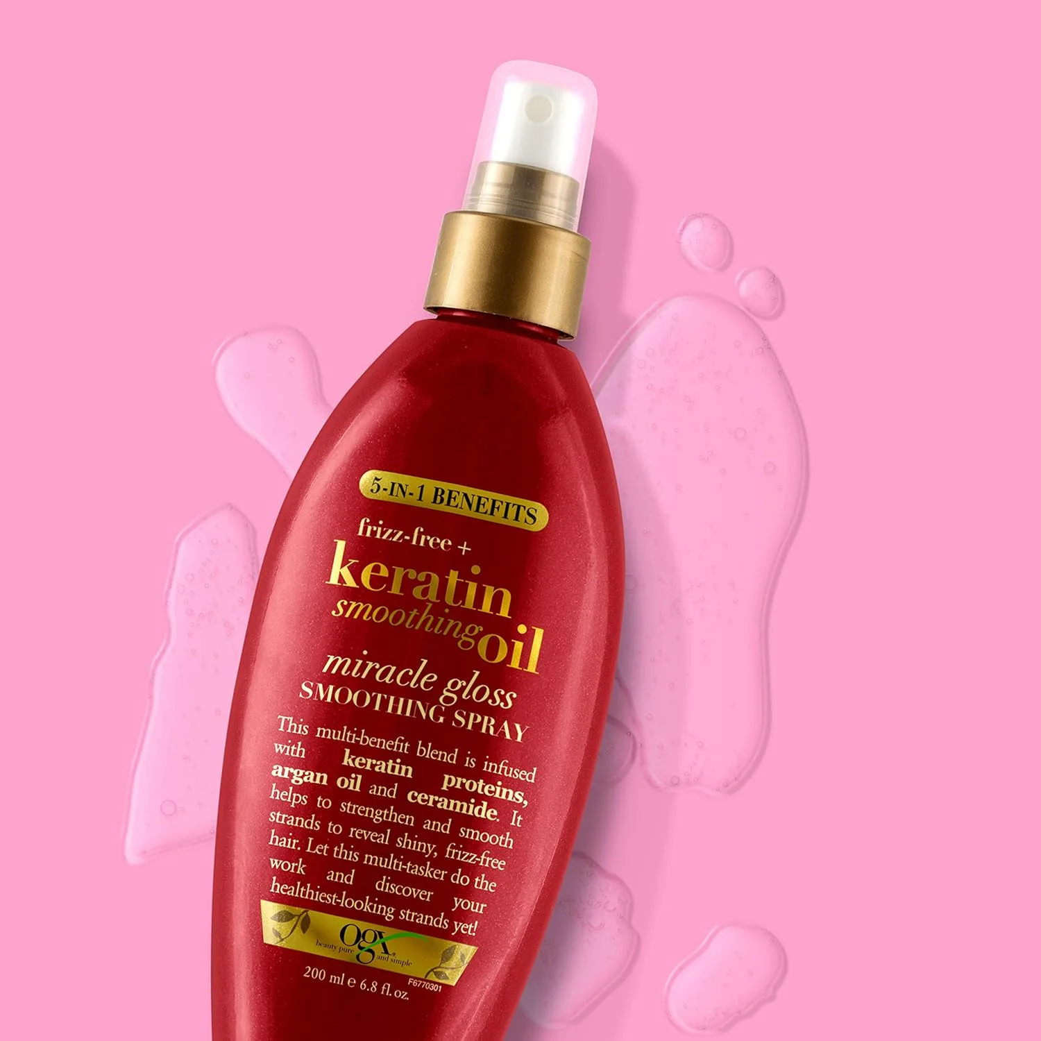 اسپری براق کننده روغن صاف کننده کراتین OGX Frizz-Free +، 5 در 1، ضد وز و درخشان کننده مو، حاوی روغن آرگان اسپری براق کننده روغن صاف کننده کراتین OGX Frizz-Free +، 5 در 1، ضد وز و درخشان کننده مو، حاوی روغن آرگان