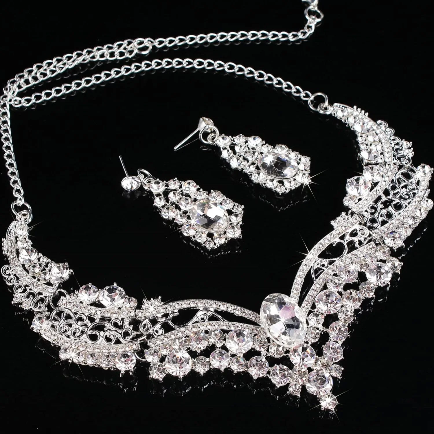 ست جواهرات عروس SYOSI نقره ای کریستالی شامل گردنبند عروسی، گوشواره و آویز نگین دار اشکی، مناسب برای زنان و ساقدوش عروس (ست 3 تکه) ست جواهرات عروس SYOSI نقره ای کریستالی شامل گردنبند عروسی، گوشواره و آویز نگین دار اشکی، مناسب برای زنان و ساقدوش عروس (ست 3 تکه)