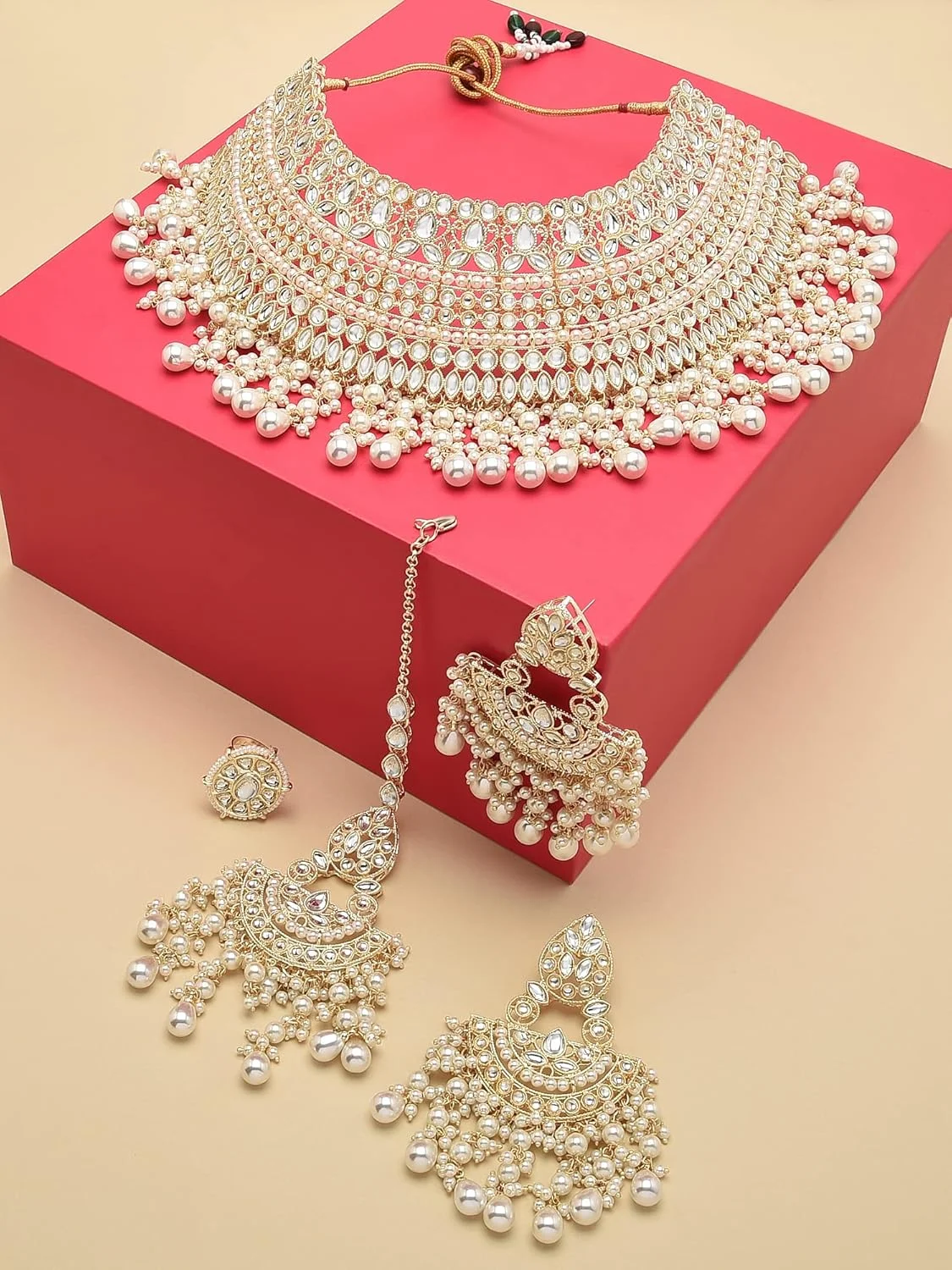 زیوری پرلز، ست گردنبند چوکر، گوشواره، مانگ تیکا و انگشتر زنانه با طرح کندن طلایی - ZPFK12221 زیوری پرلز، ست گردنبند چوکر، گوشواره، مانگ تیکا و انگشتر زنانه با طرح کندن طلایی - ZPFK12221