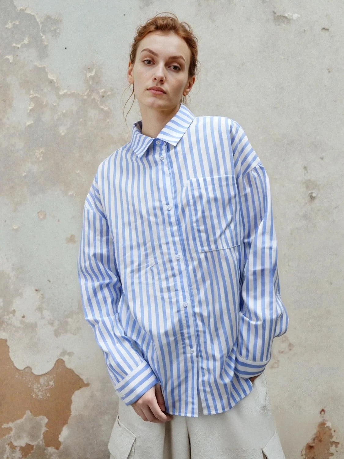 بلوز آستین بلند زنانه با طرح راه راه، مدل آزاد و راحت، مناسب استفاده روزمره و دارای دکمه