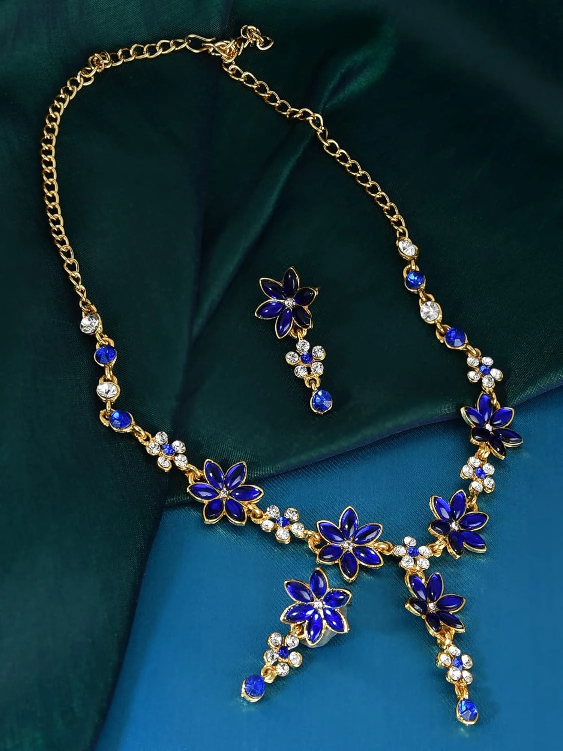 ست گردنبند زنانه نگین دار برگ آبی سلطنتی ZAVERI PEARLS با الماس اتریشی طرح گل (آبی) (ZPFK5185) ست گردنبند زنانه نگین دار برگ آبی سلطنتی ZAVERI PEARLS با الماس اتریشی طرح گل (آبی) (ZPFK5185)