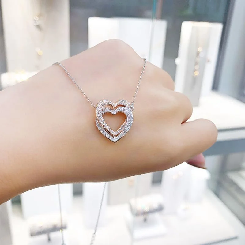 گردنبند آویز قلب دوتایی نقره ای و رزگلد با کریستال جواهرات مد روز J.Rosée مدل JR-1301، مناسب هدیه برای بانوان گردنبند آویز قلب دوتایی نقره ای و رزگلد با کریستال جواهرات مد روز J.Rosée مدل JR-1301، مناسب هدیه برای بانوان