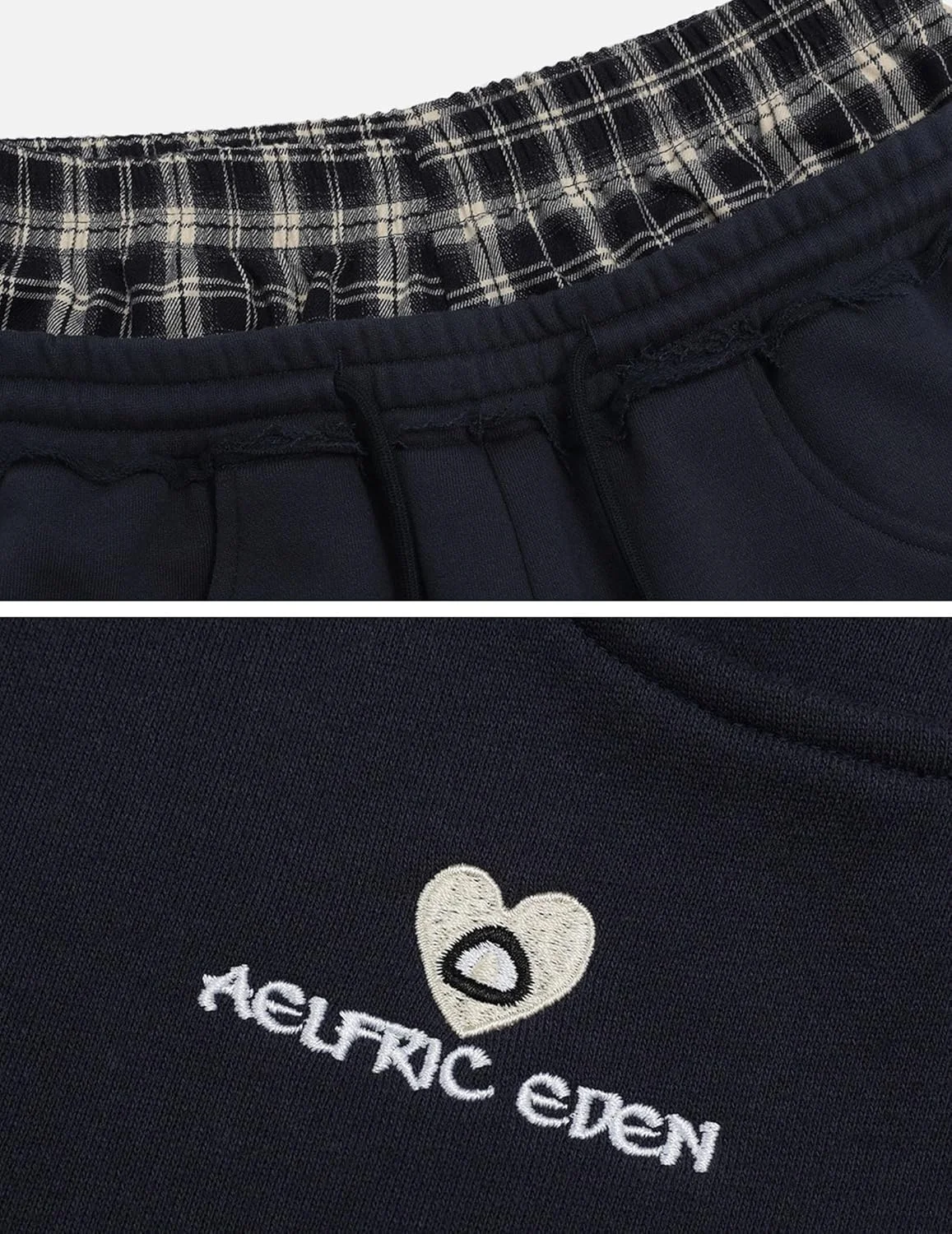 شلوار گرمکن پاچه گشاد زنانه الفریک ادن با طرح تکه دوزی چهارخانه، شلوار بلند و آزاد با جیب شلوار گرمکن پاچه گشاد زنانه الفریک ادن با طرح تکه دوزی چهارخانه، شلوار بلند و آزاد با جیب