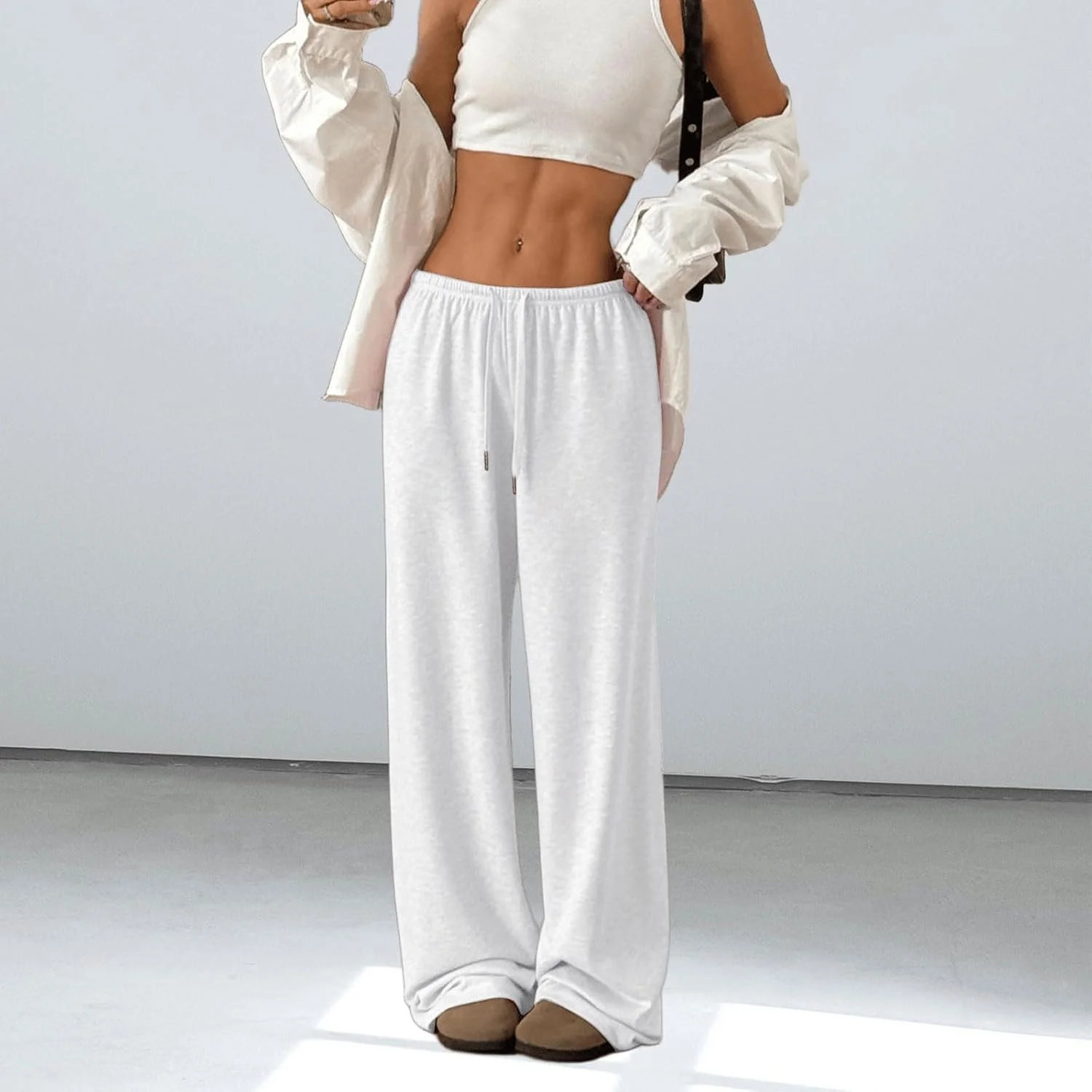 شلوار جاگر زنانه دیجانزا با فاق کوتاه، مدل Y2K، راسته و پاچه گشاد، دارای بند و جیب