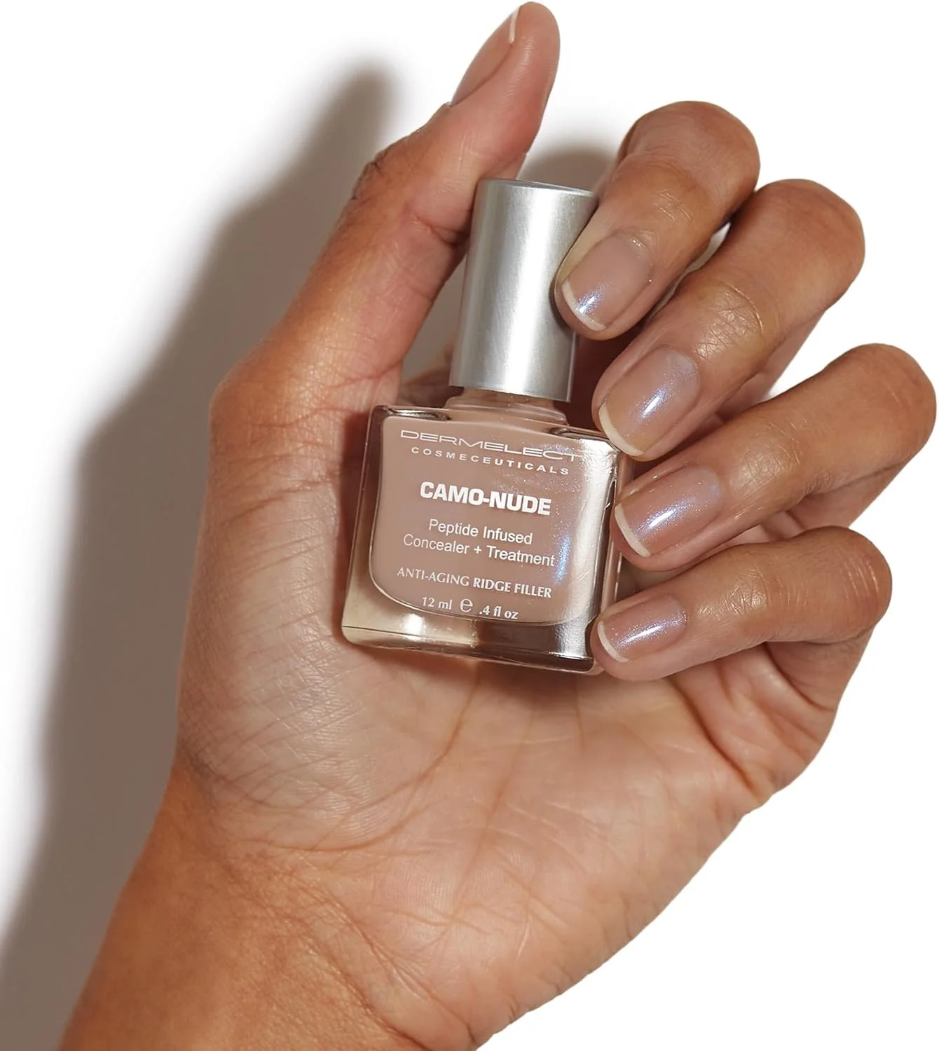 درملکت کانسیلر + درمان Camo-Nude - لایه پایه مراقبت از ناخن با پپتیدهای پروتئین کراتین، بیوتین، تقویت کننده، صاف کننده و پوشاننده برای ناخن های دارای شیار، زرد شده و شکافته 12 میلی لیتر درملکت کانسیلر + درمان Camo-Nude - لایه پایه مراقبت از ناخن با پپتیدهای پروتئین کراتین، بیوتین، تقویت کننده، صاف کننده و پوشاننده برای ناخن های دارای شیار، زرد شده و شکافته 12 میلی لیتر
