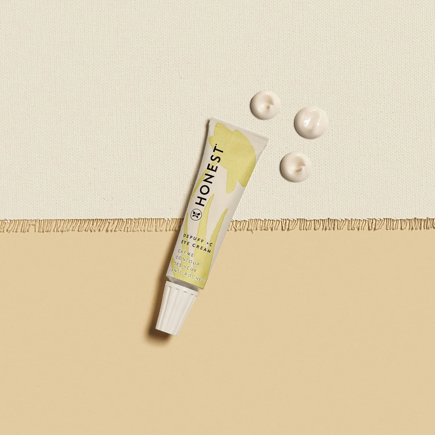 کرم دور چشم روشن کننده و ضد پف ویتامین C هانست بیوتی | کاهش تیرگی دور چشم | حاوی ویتامین C، عصاره گل بابونه، اسید هیالورونیک | دارای تاییدیه EWG، وگان و بدون تست حیوانی | 15 میلی لیتر