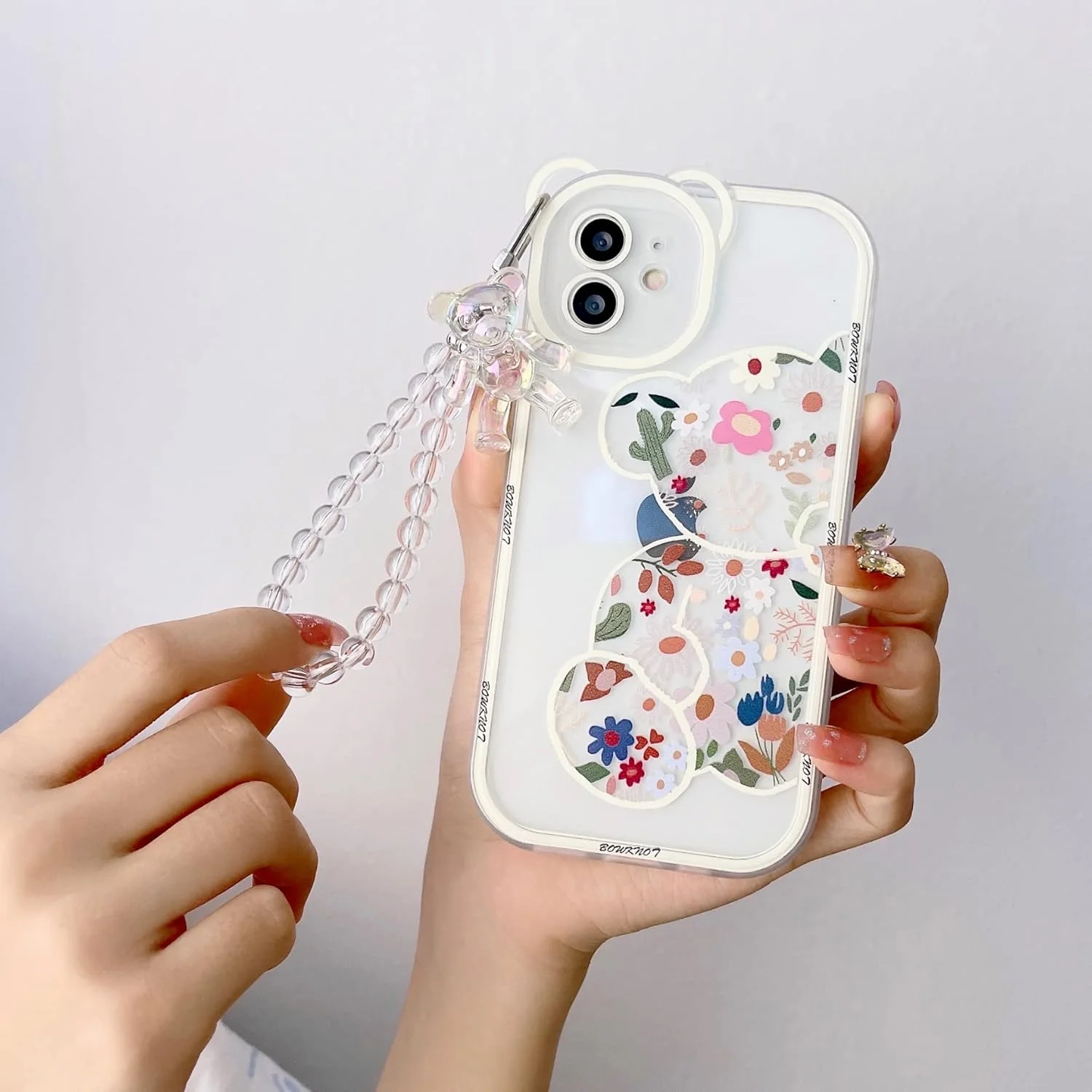قاب گوشی Shinymore سازگار با آیفون 12، محافظ دوربین طرح گل و خرس شفاف و زیبا با زنجیر دستبندی دوست داشتنی مناسب دختران و بانوان قاب گوشی Shinymore سازگار با آیفون 12، محافظ دوربین طرح گل و خرس شفاف و زیبا با زنجیر دستبندی دوست داشتنی مناسب دختران و بانوان