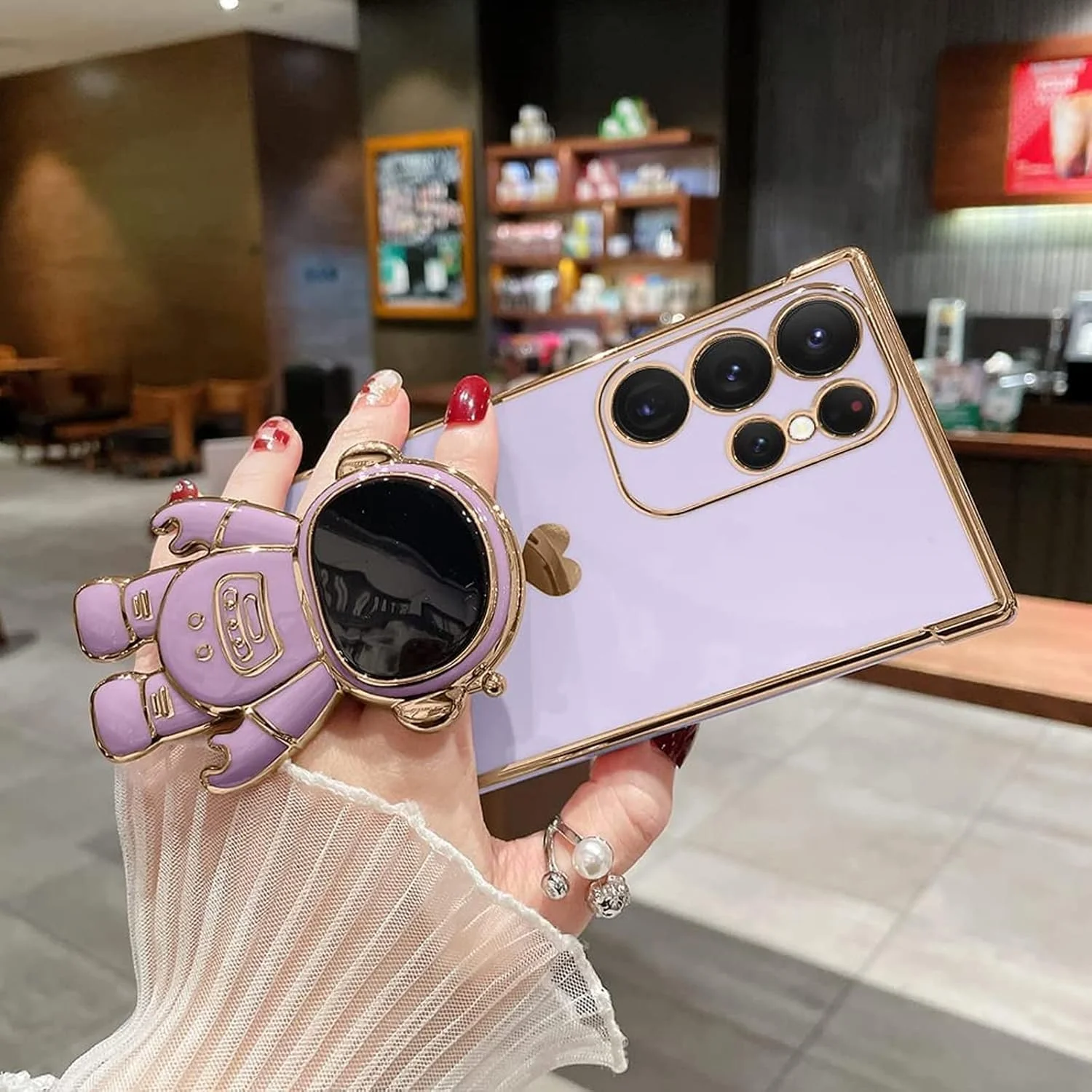 قاب گوشی ELEPIK برای سامسونگ گلکسی S25 Ultra با پایه نگهدارنده زنانه، طراحی فضانورد شیک و لوکس، محافظت کامل از دوربین، TPU نرم، قاب محافظ باریک ضد ضربه، بنفش