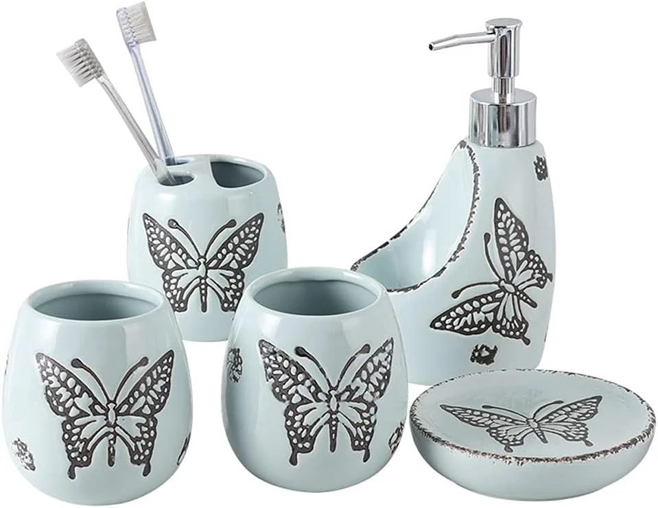 ست لوازم جانبی حمام شامل جا مایع دستشویی - 5 تکه سرامیکی شامل جا مایع، جا مسواکی، لیوان و جا صابونی، بطری های آبی و صورتی