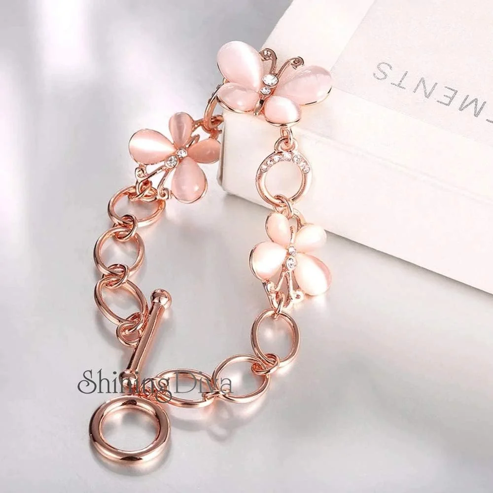 ست گوشواره و دستبند شیک و جدید زنانه و دخترانه با روکش طلای رزگلد 18 عیار ست گوشواره و دستبند شیک و جدید زنانه و دخترانه با روکش طلای رزگلد 18 عیار