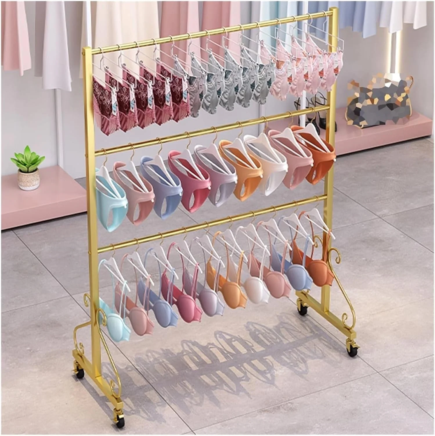 ریل لباس، قفسه فلزی نمایش لباس زیر، قفسه فروشگاهی لباس، سوتین، شورت، لباس شنا، قفسه نگهداری خرده فروشی با چرخ برای اتاق خواب/بوتیک، جابجایی آسان (طلایی، 60x40x130 سانتی متر)