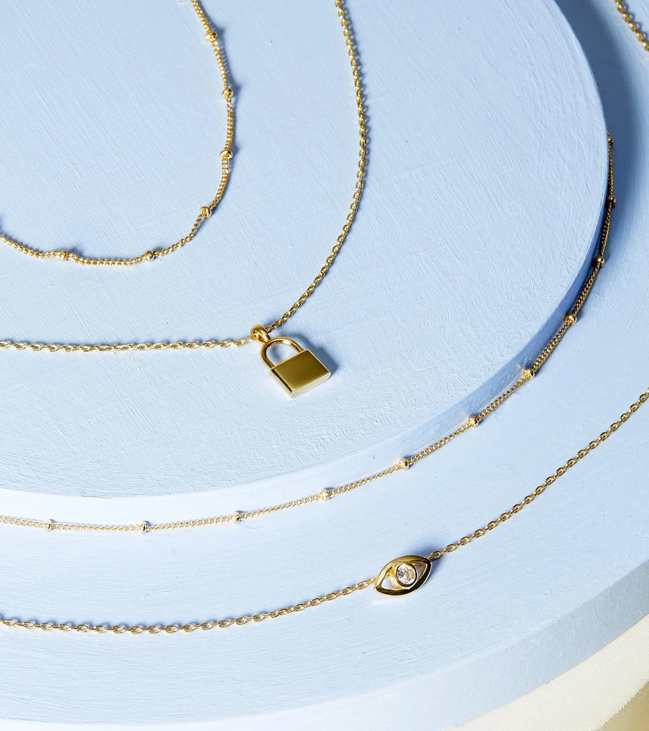 گردنبندهای لایه ای با روکش طلای 14 عیار PAVOI | گردنبندهای آویز با طراحی مینیمالیستی شیک | پروانه، قلب، قفل، چشم نظر، سکه، رعد و برق، دایره، آویز صلیب برای زنان