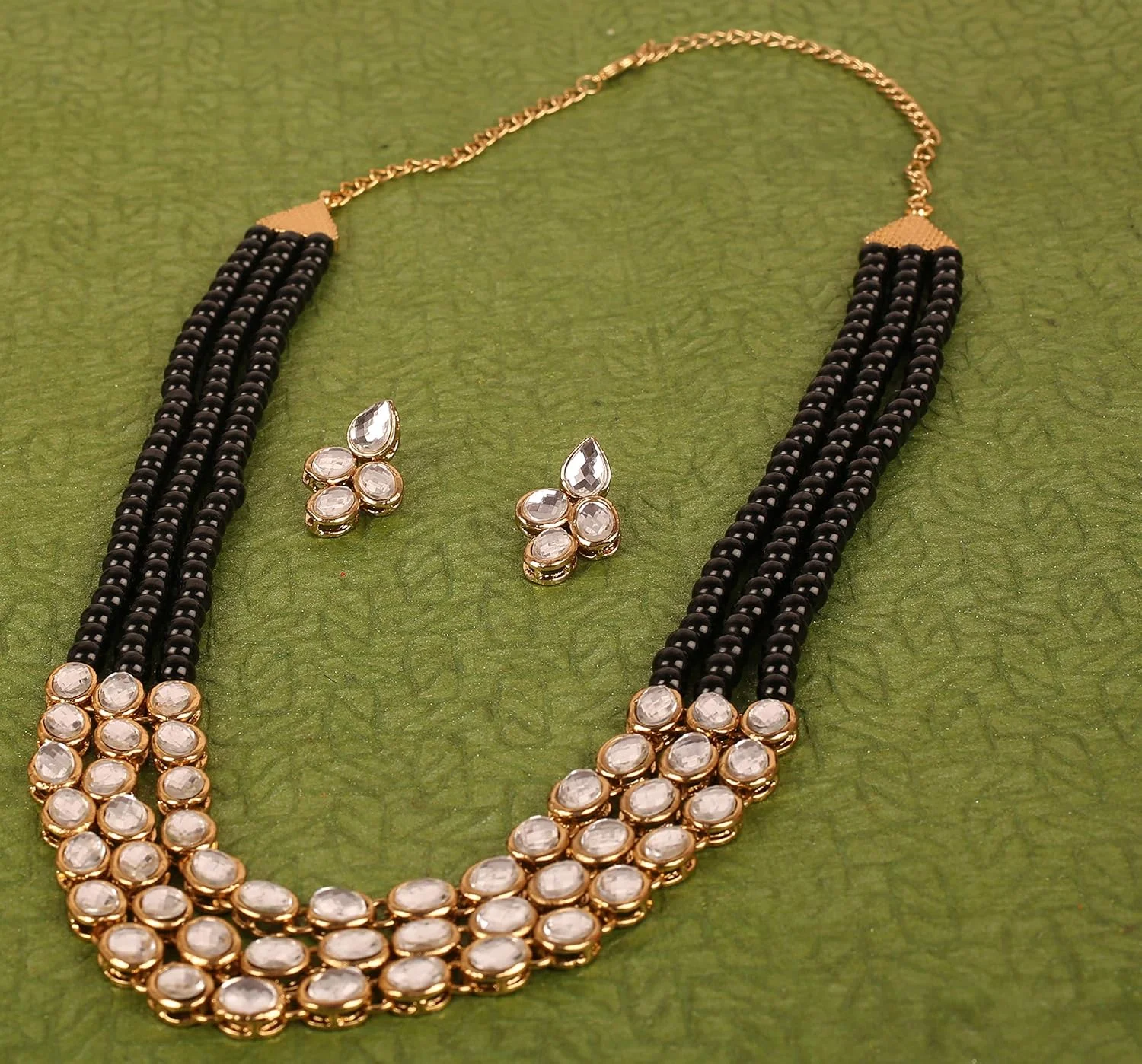 تاچ استون جدید! "مجموعه کندن معاصر" گردنبند و جواهرات عروسکی الهام گرفته از بالیوود و طرح های موغال با سه ردیف مهره های اونیکس مشکی مصنوعی با روکش طلای عتیقه برای بانوان تاچ استون جدید! "مجموعه کندن معاصر" گردنبند و جواهرات عروسکی الهام گرفته از بالیوود و طرح های موغال با سه ردیف مهره های اونیکس مشکی مصنوعی با روکش طلای عتیقه برای بانوان