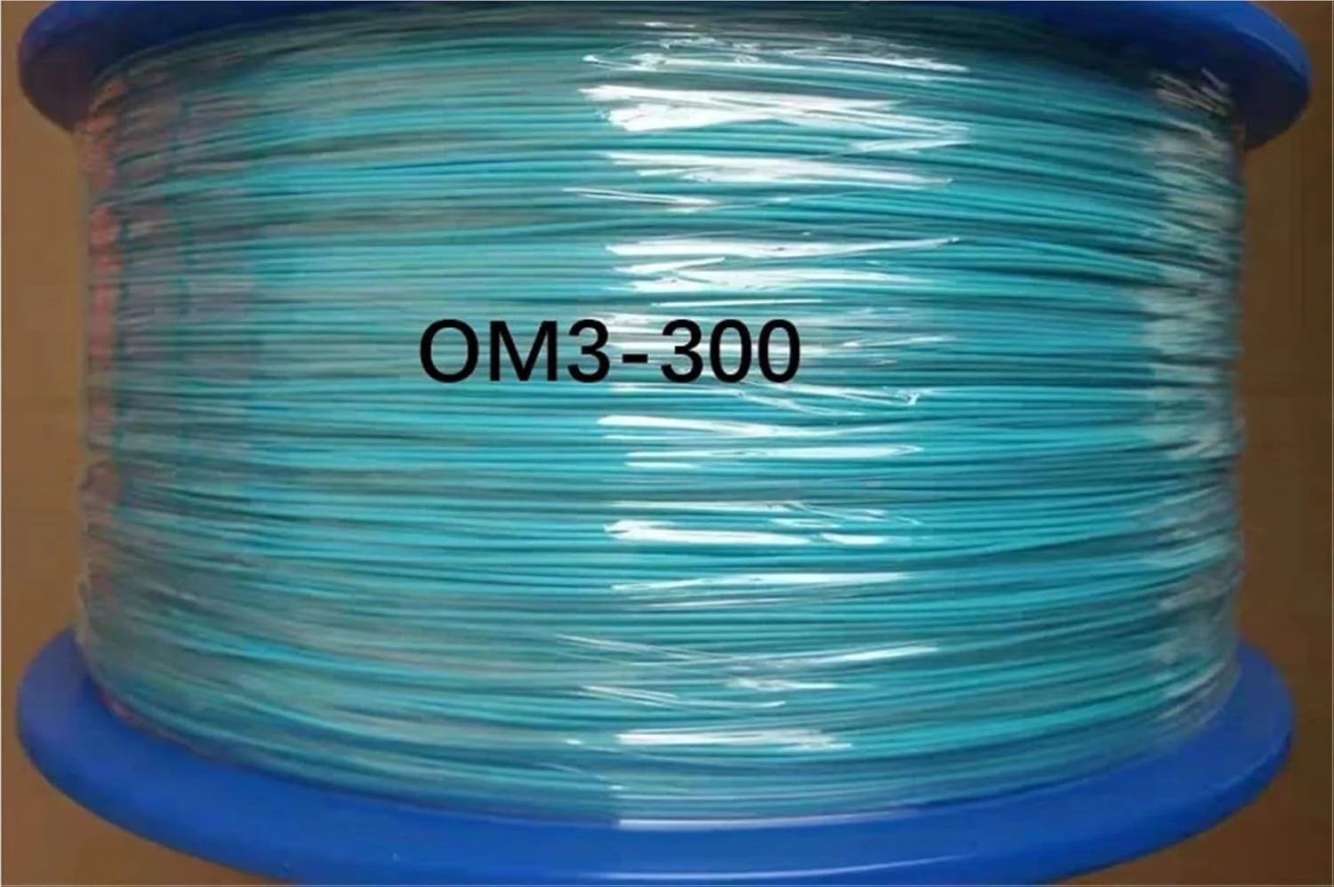 کابل فیبر نوری تایت 0.9 میلی‌متری OM3-300 مالتی مود رنگی برای پیگتیل‌های فیبر نوری FTTH، کابل فیبر نوری 1 کیلومتر/حلقه 1000 متر