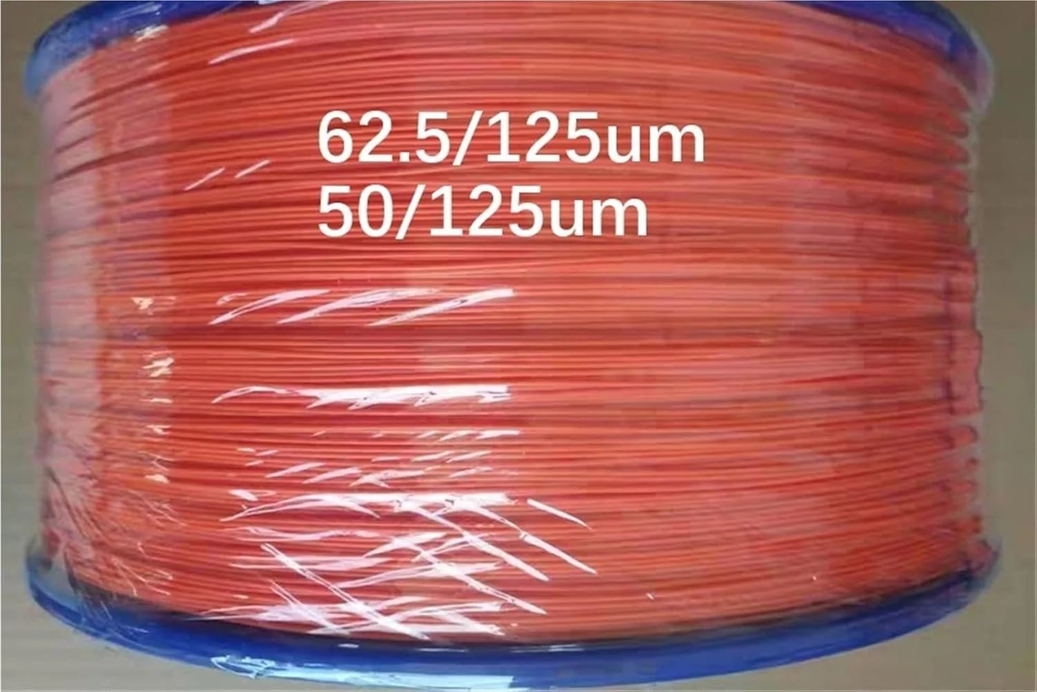 کابل فیبر نوری تایتد 0.9 میلی‌متری چند حالته نارنجی 50/125um 62.5/125um برای کابل فیبر نوری FTTH، 2.5 کیلومتر در هر رول 2500 متر (50-125um)