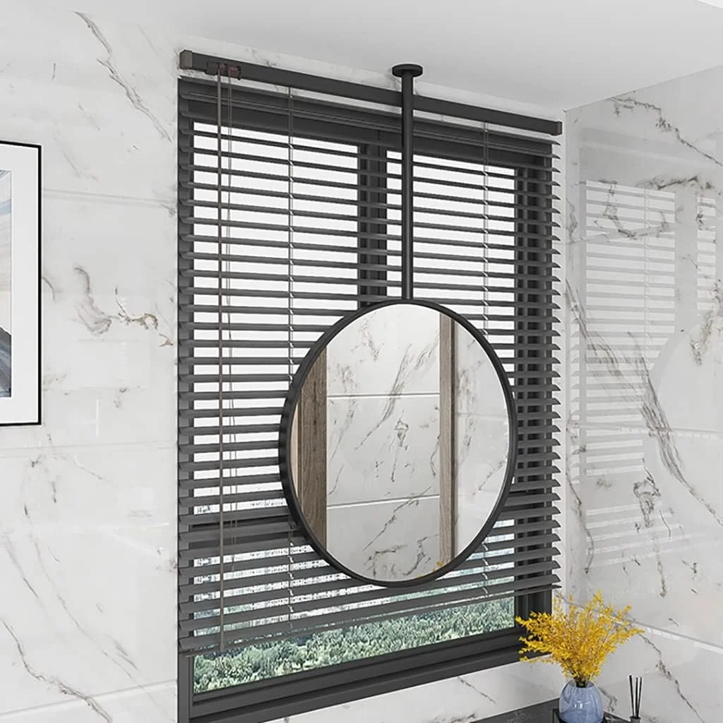 آینه بوم، آینه آویز، آینه گرد دیواری، آینه دیواری، آینه حمام، آینه آرایش، آینه میز آرایش اتاق خواب، آینه دکوری ورودی، آینه با قاب فلزی (رنگ: مشکی، اندازه: 50 * 70 سانتی متر)