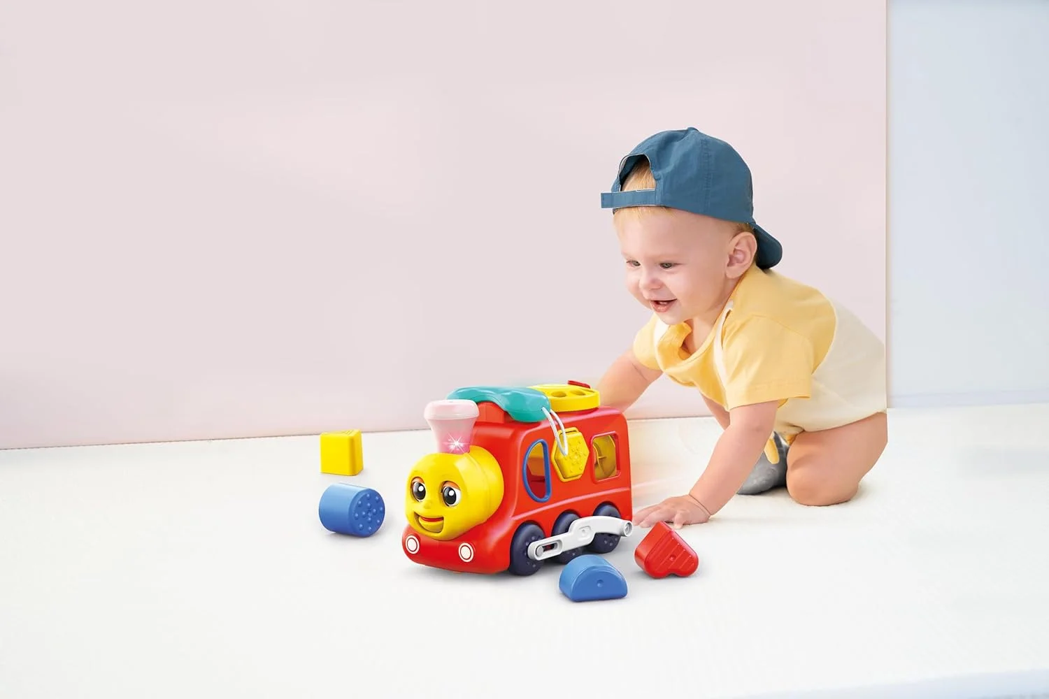 اسباب بازی قطار آموزشی هولا برای کودکان نوپا - حرکت با برخورد، دارای چراغ، صدا، موسیقی، حالت کوئیز و فعالیت های آموزشی - اسباب بازی های آموزشی برای پسران و دختران 18 ماهه و بالاتر