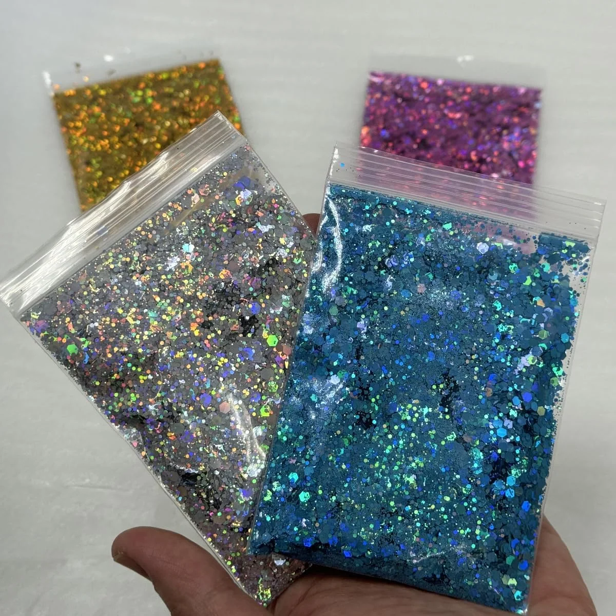 پودر اکلیلی آرایشی، 4 عدد 30 گرمی، پودر اکلیلی لیزری برای صورت، بدن، ناخن، مناسب برای هنرهای دستی و طراحی ناخن، رنگ های نقره ای، طلایی، صورتی و آبی