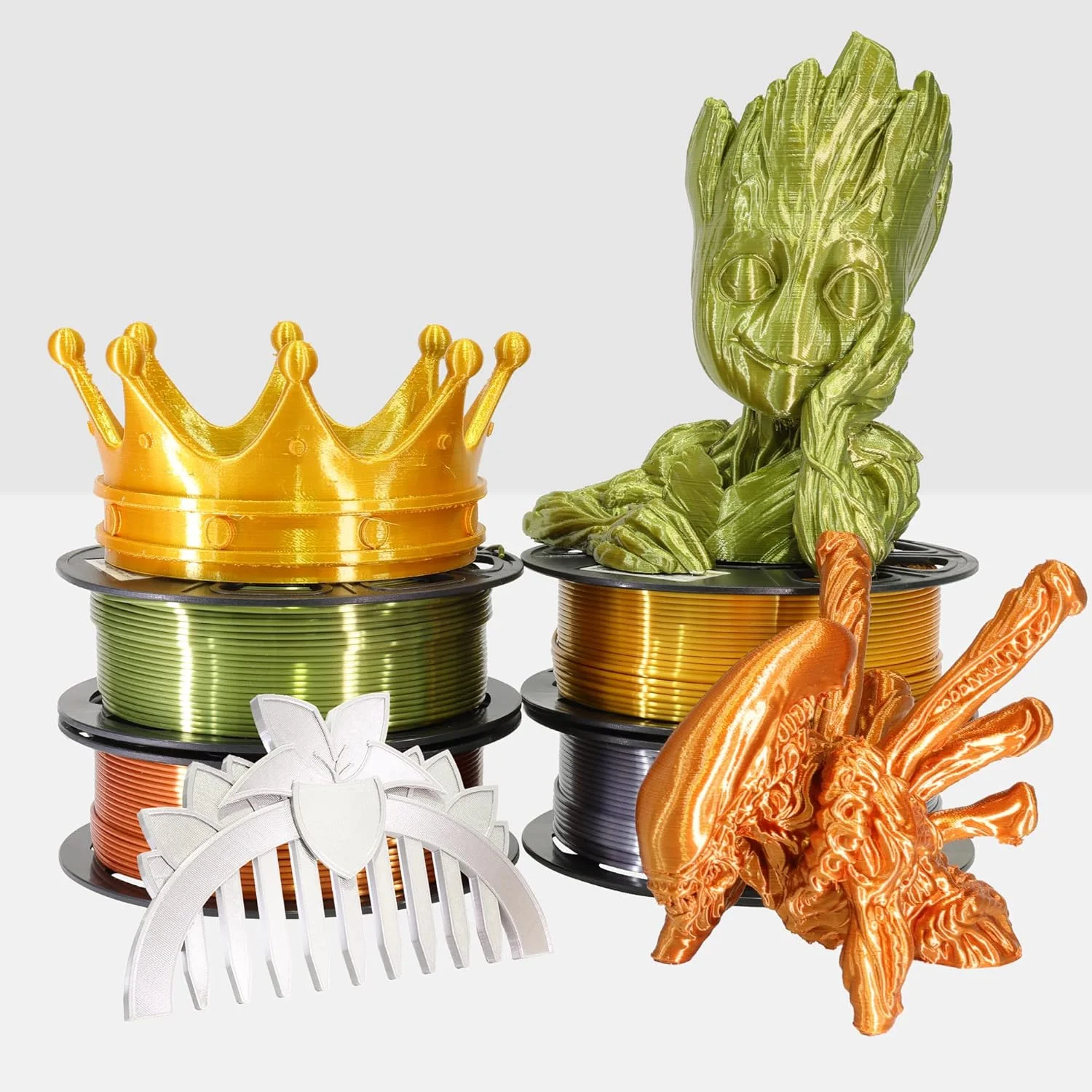 بسته چهارتایی فیلامنت PLA ابریشمی براق MIKA3D با قطر 1.75 میلی‌متر، شامل 4 رنگ فلزی: طلایی متالیک براق/نقره‌ای/مسی/برنزی، هر رول 250 گرم، مجموعا 1 کیلوگرم متریال فیلامنت پرینت سه بعدی به همراه ابزار اضافی پرینت سه بعدی