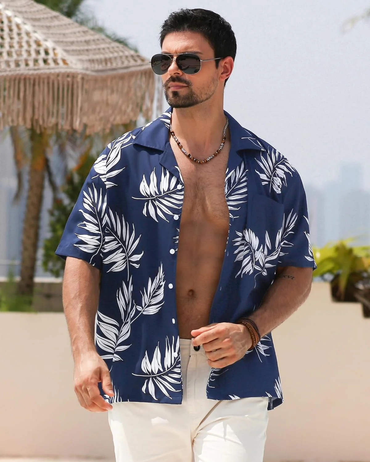 پیراهن مردانه آستین کوتاه طرح هاوایی با طرح های گلدار و دکمه دار مناسب تعطیلات استوایی و ساحلی