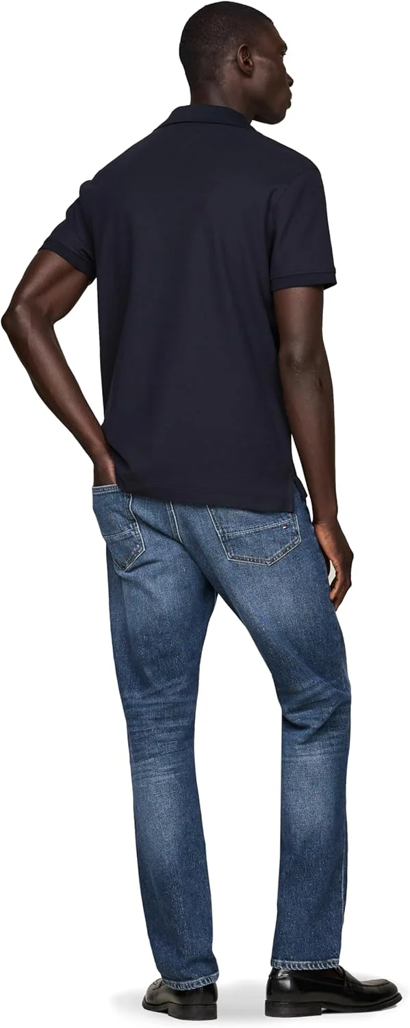 پولوشرت آستین کوتاه مردانه تامی هیلفیگر با فیت معمولی، کشسان و طرح لوگوی عمودی پولوشرت آستین کوتاه مردانه تامی هیلفیگر با فیت معمولی، کشسان و طرح لوگوی عمودی