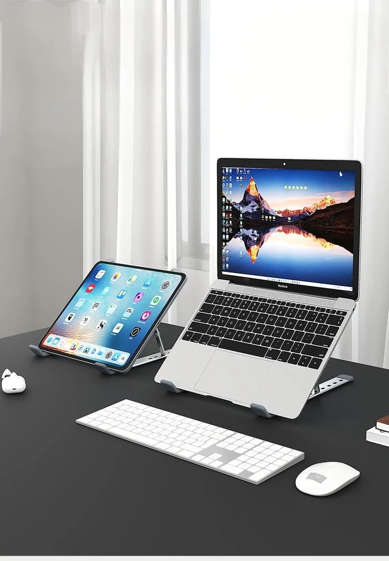 پایه تاشو لپ تاپ آلیاژ آلومینیوم، پایه محکم کامپیوتر نوت بوک برای میز، نگهدارنده قابل تنظیم و قابل حمل ضد لغزش برای لپ تاپ ها و تبلت های 10-15.6 اینچی - نقره ای پایه تاشو لپ تاپ آلیاژ آلومینیوم، پایه محکم کامپیوتر نوت بوک برای میز، نگهدارنده قابل تنظیم و قابل حمل ضد لغزش برای لپ تاپ ها و تبلت های 10-15.6 اینچی - نقره ای